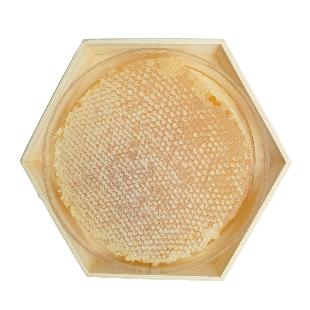 Hexagonal wooden container with a textured beige substance inside on a white background