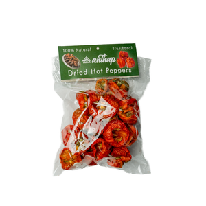 Bag of dried hot peppers with a green label on a white background