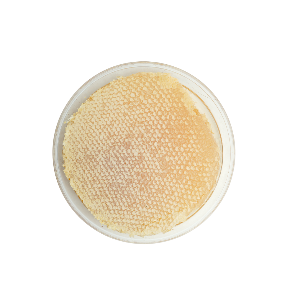 Round container with beige textured powder on a white background