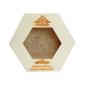 Hexagonal honeycomb honey product with 'Karakovan Bali' branding on a white background